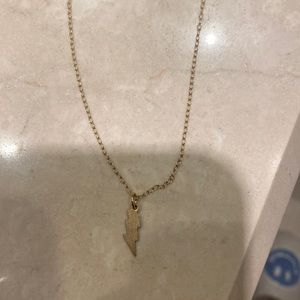 Gold- plated lighting bolt necklace from a boutique called trend in my city